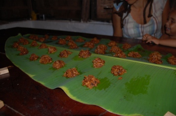 Coconut drops cooling on a banana leaf (Jamaican wax paper!)